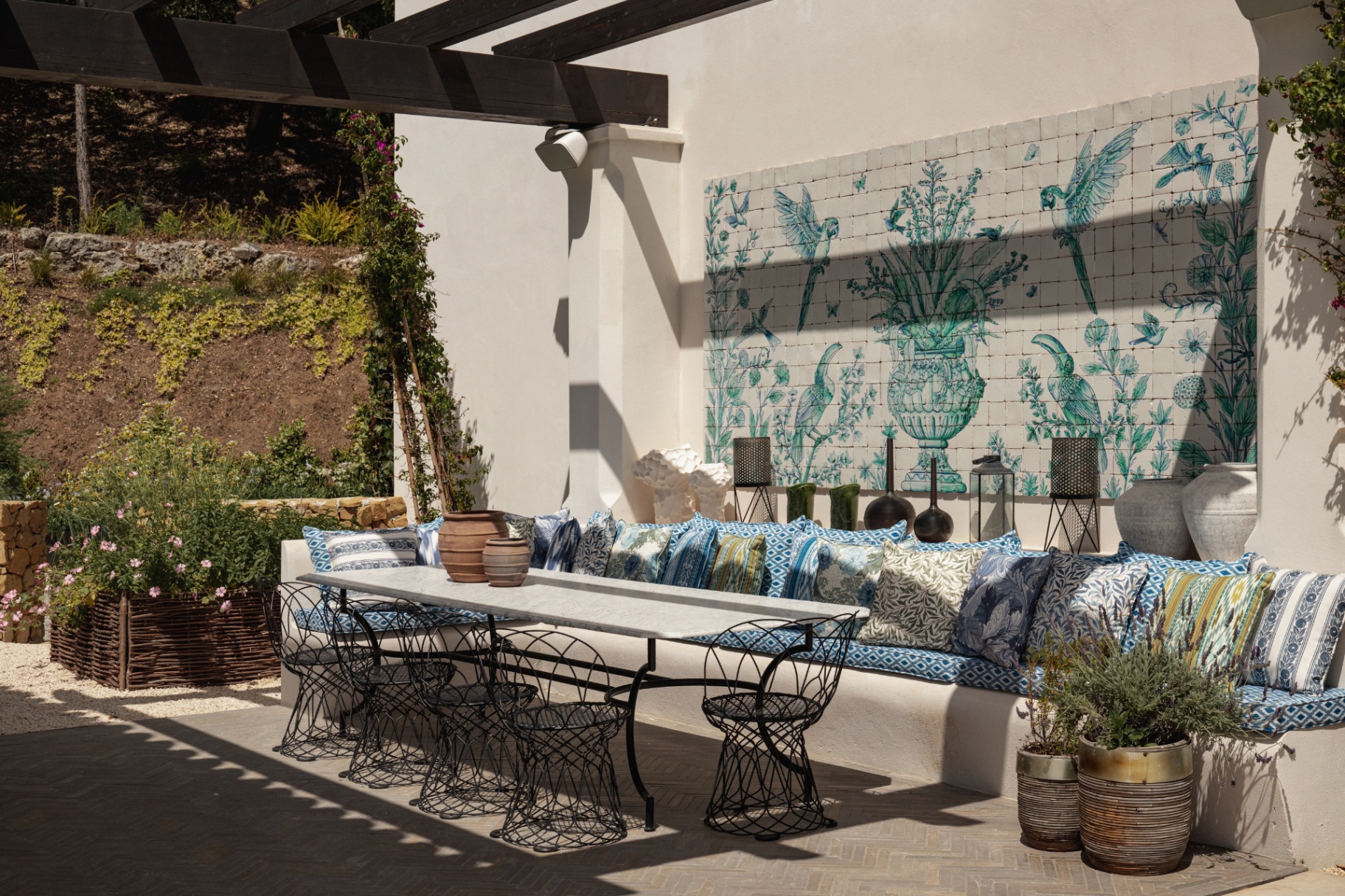 Covered outdoor terrace with arched openings.
